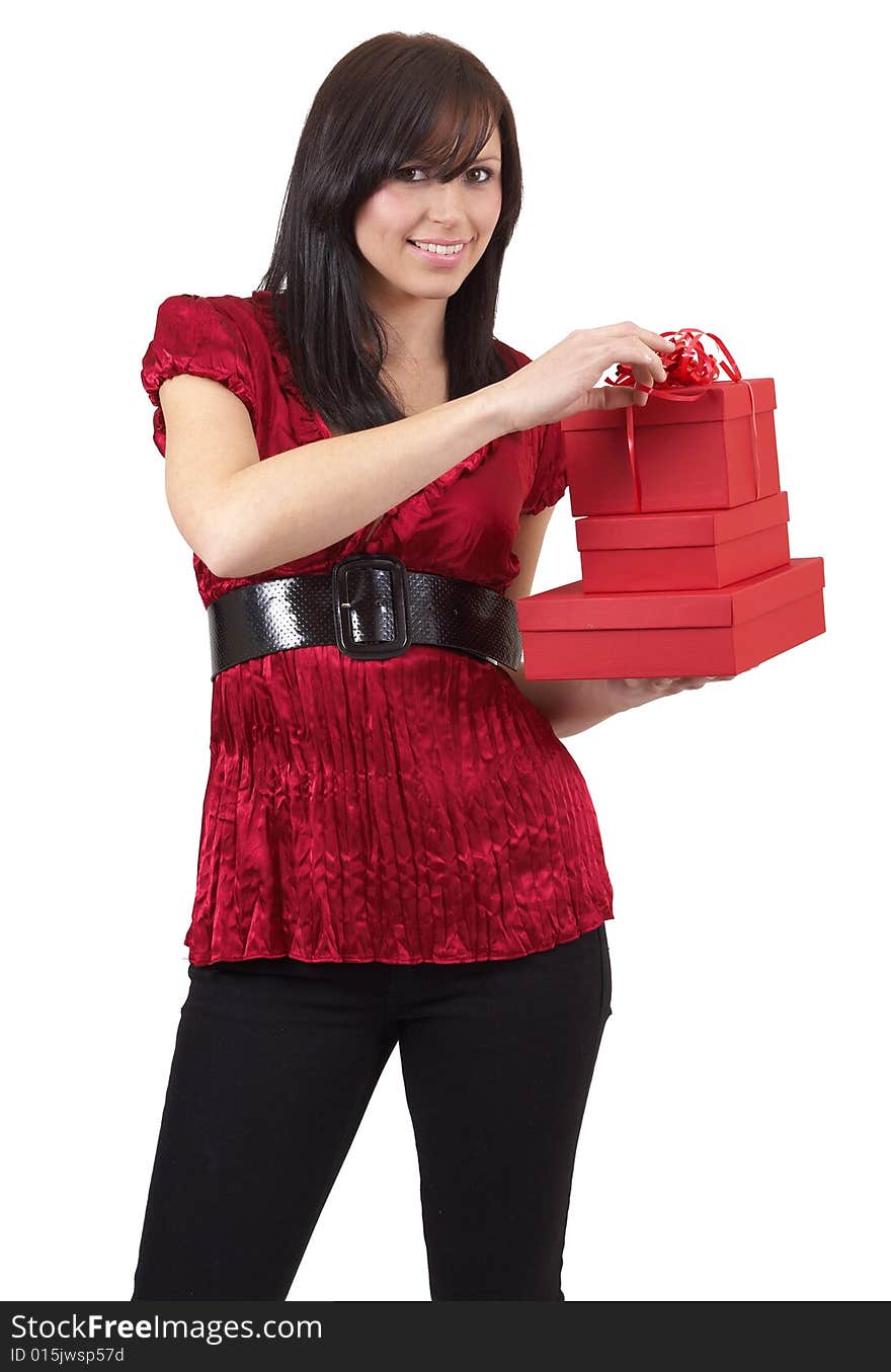 Portrait of a beautiful young brunette woman holding gift boxes at a celebration. Isolated on white background. Portrait of a beautiful young brunette woman holding gift boxes at a celebration. Isolated on white background