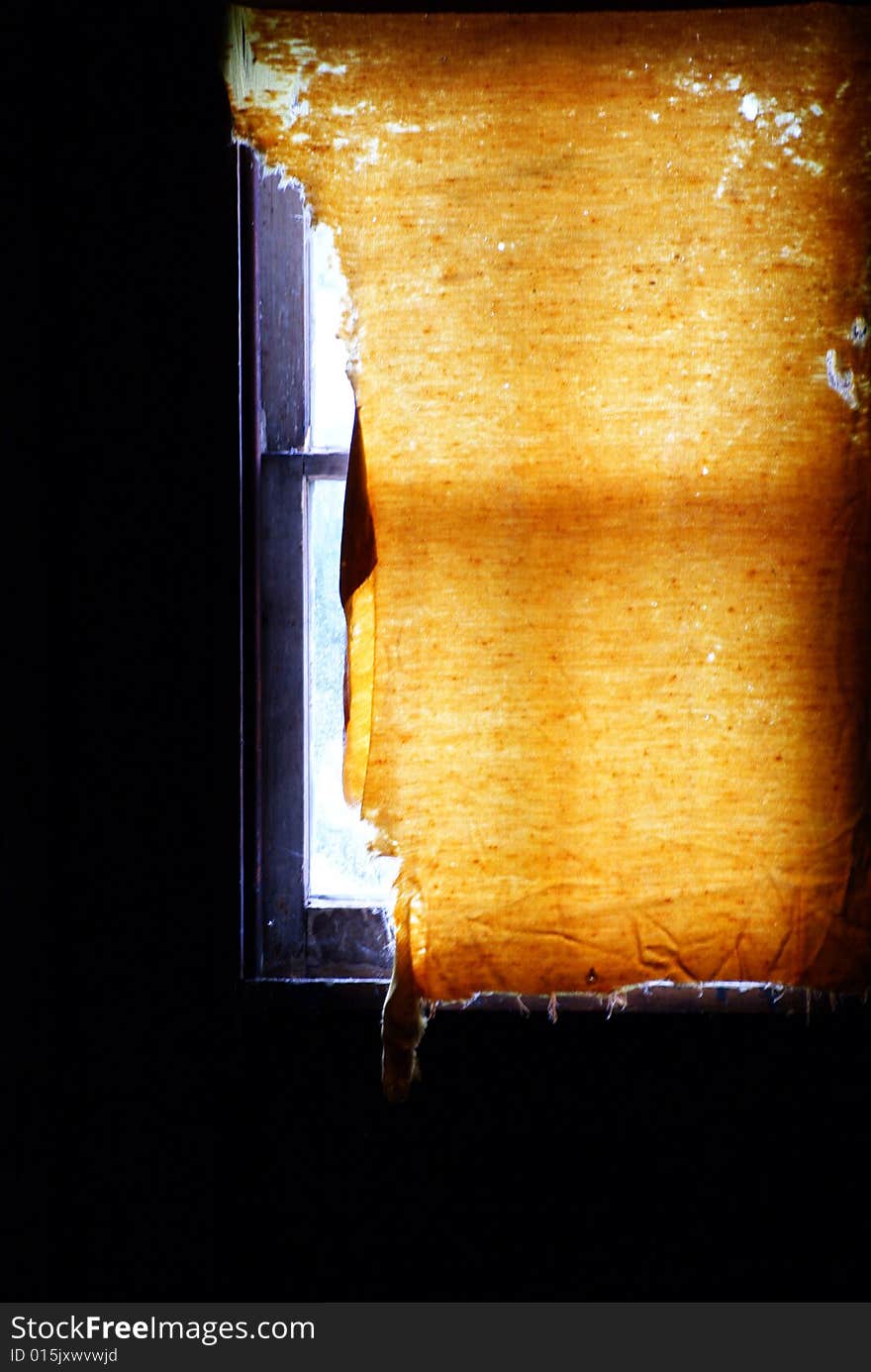 Old window shade in attic of farm house