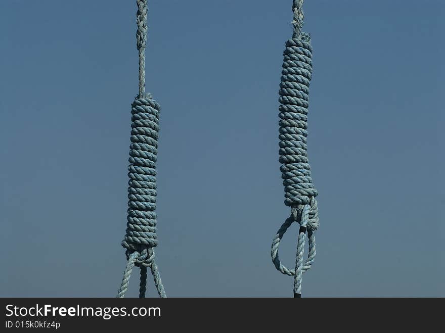 Blue rope hanging on a blue background