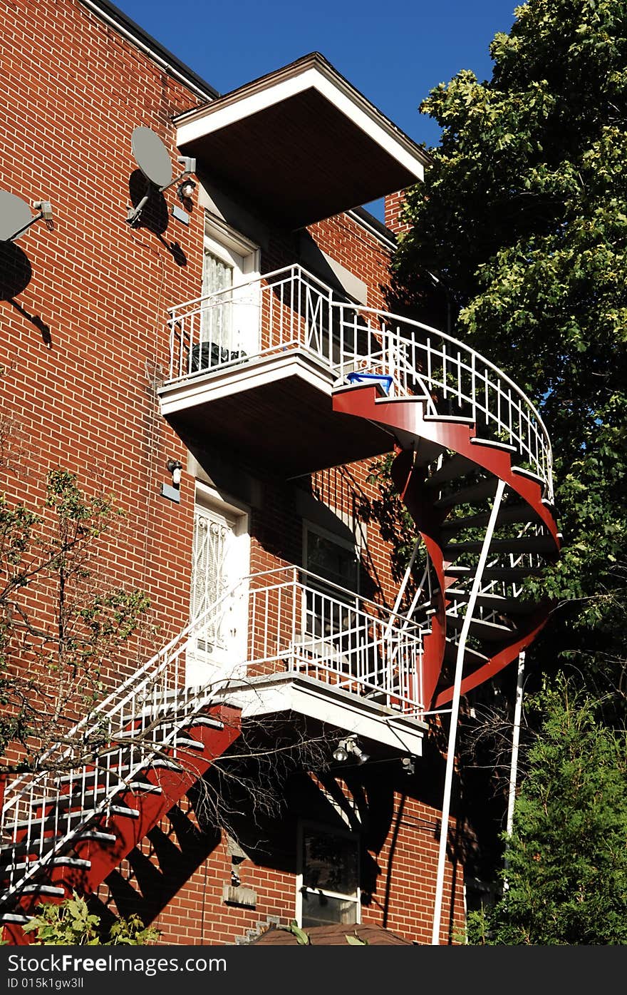 An outside colorful stairwell on an three story apartment building in Montreal, Canada. An outside colorful stairwell on an three story apartment building in Montreal, Canada.