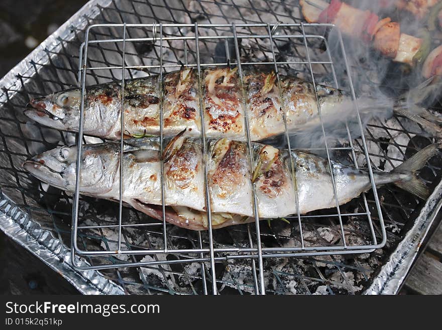 Barbecue grill with  fresh stuffed fish. Barbecue grill with  fresh stuffed fish