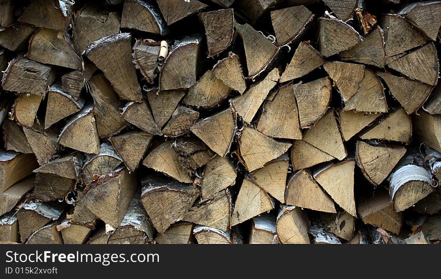 Woodpile.Birch fire wood combined in a stack