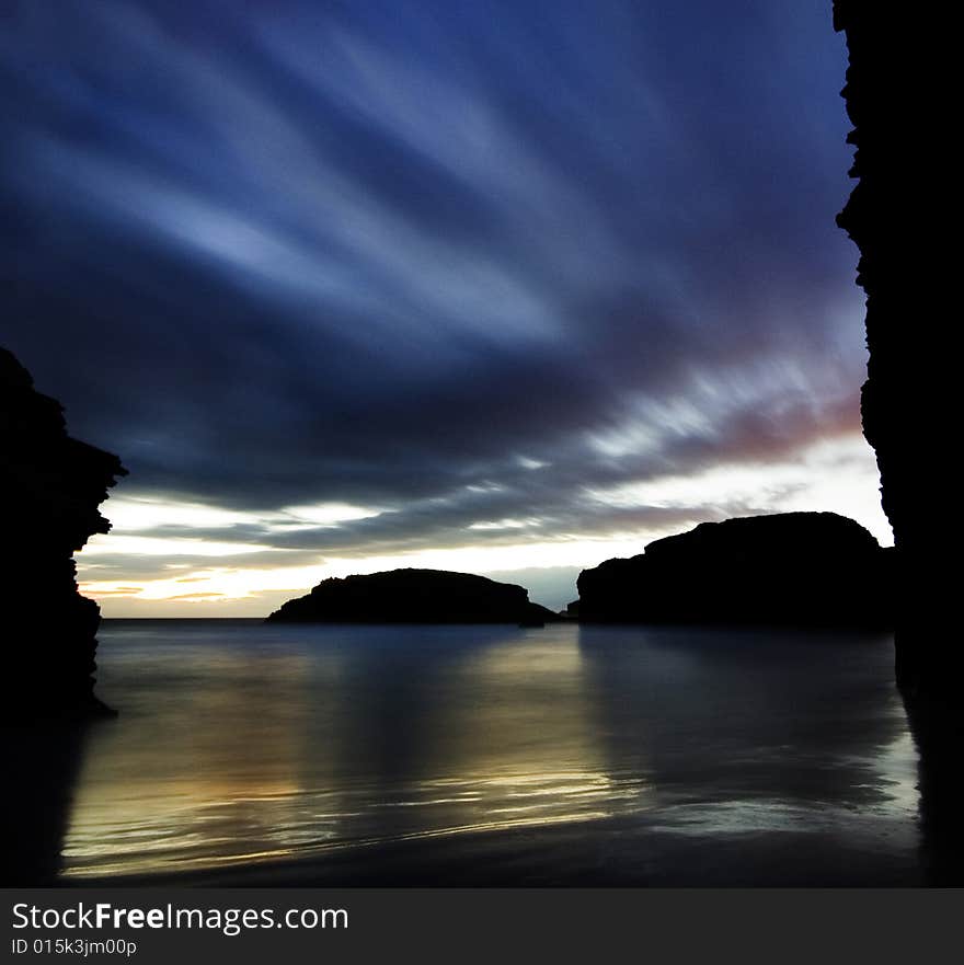 A blue and golden sunrise at the beach. A blue and golden sunrise at the beach