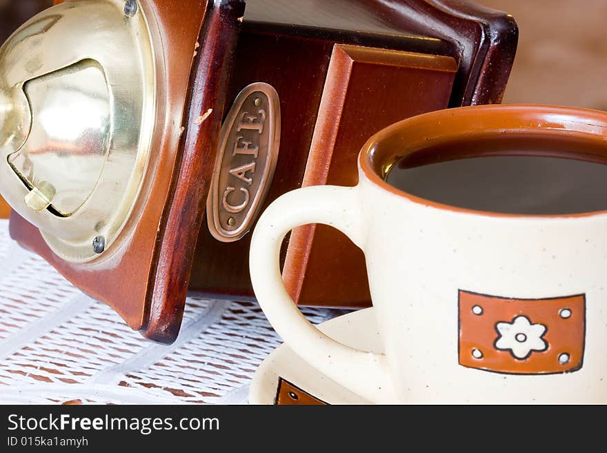 A coffee-mill on a table. A coffee-mill on a table