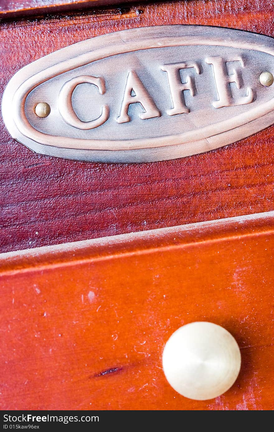 A coffee-mill on a table. A coffee-mill on a table