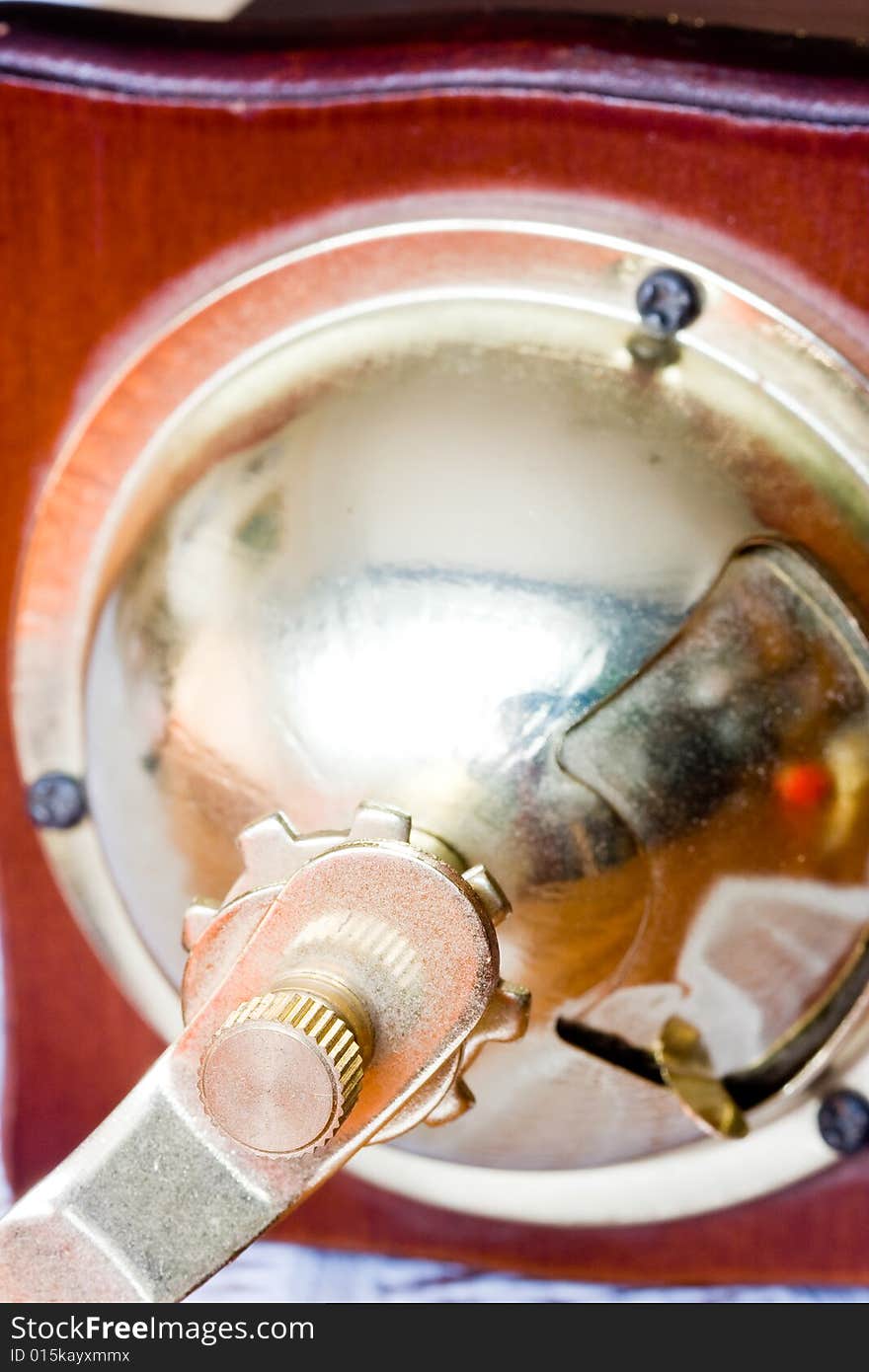 A coffee-mill on a table. A coffee-mill on a table