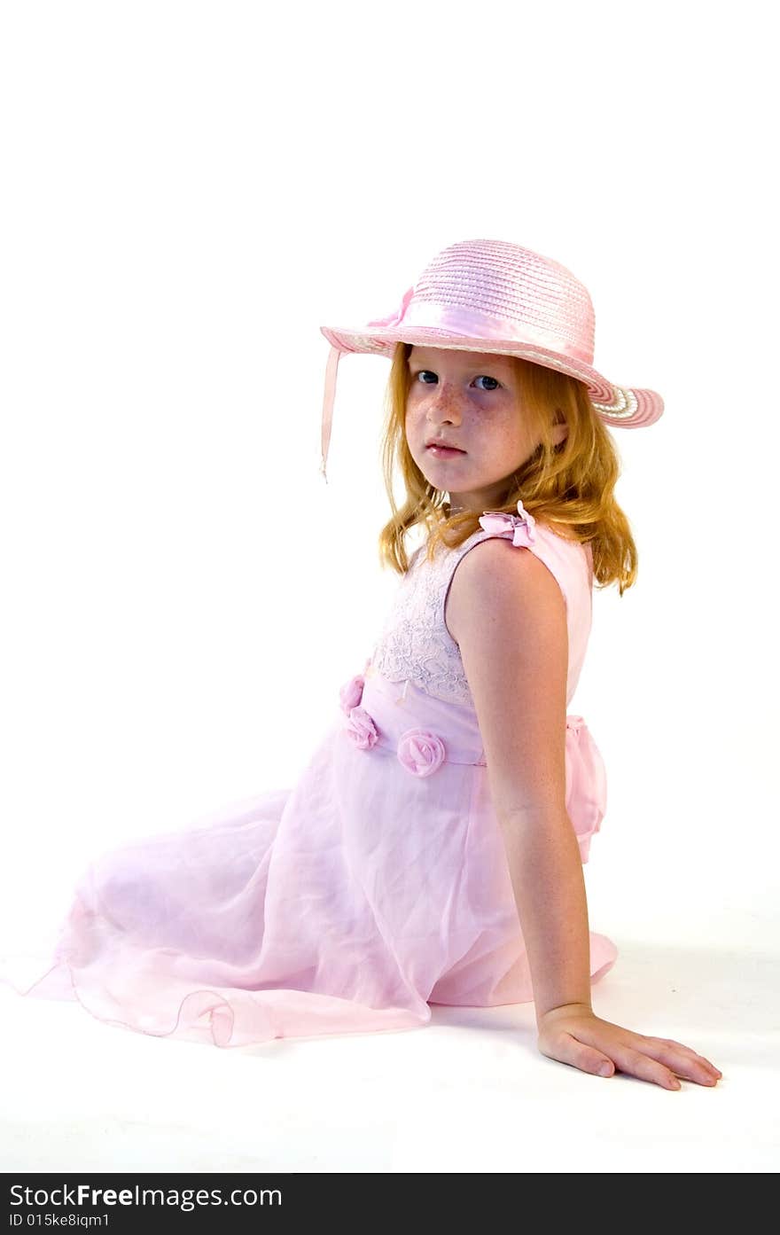 Little princess sitting on white background