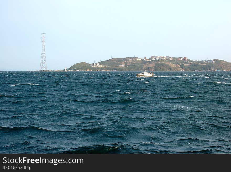 Sea scenery of Vladivostok with small cutter and storm sea. Sea scenery of Vladivostok with small cutter and storm sea.