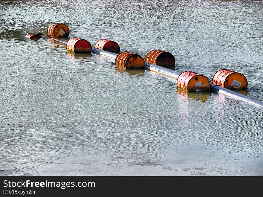 Dirty and old oil barrel floating on sea. Dirty and old oil barrel floating on sea