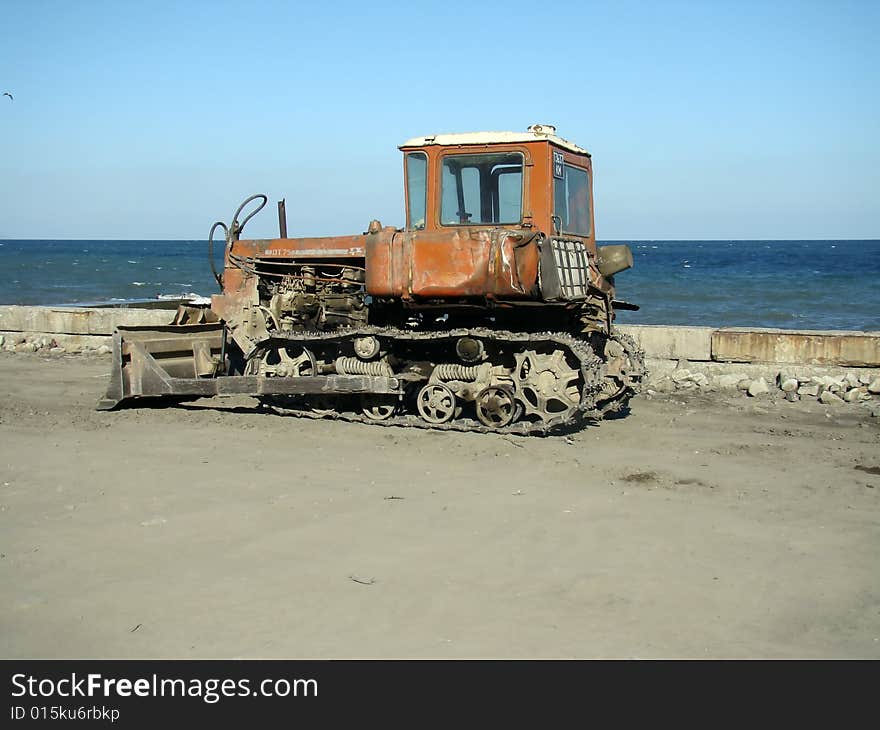 Bulldozer placed on the embankment with high detailed caterpillar. Bulldozer placed on the embankment with high detailed caterpillar