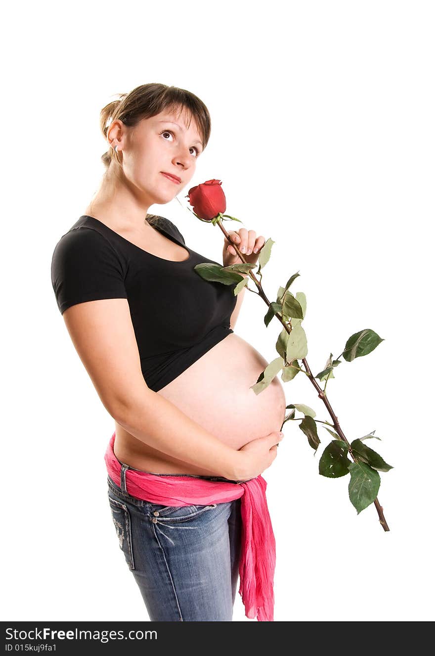 Beautiful pregnant woman with a rose