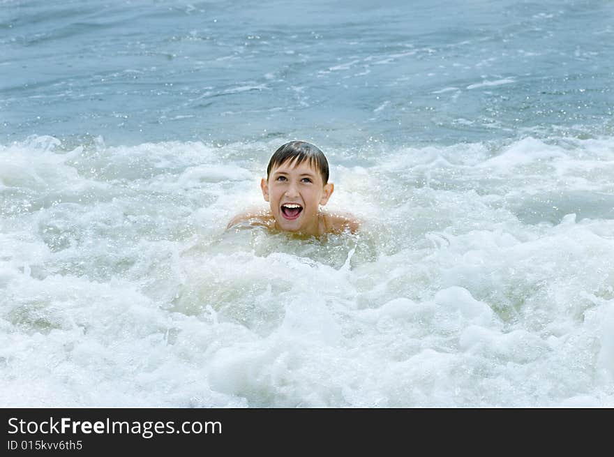 A shot of boy in sea. A shot of boy in sea