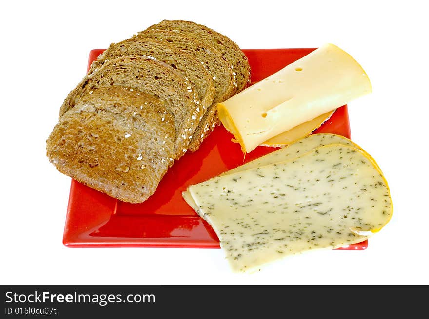 Bread and cheese on red platter, white background