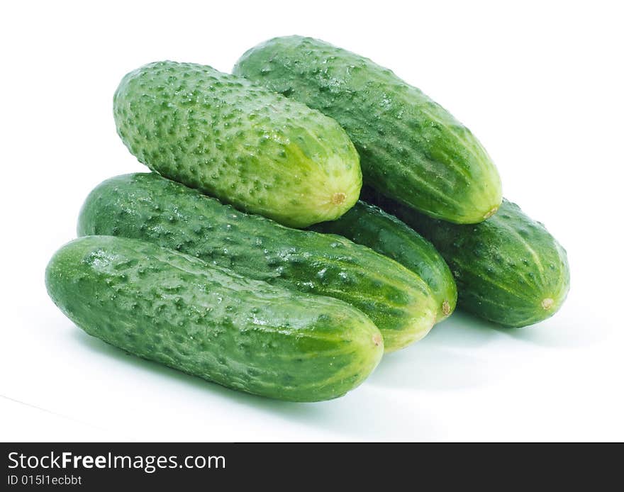 Bunch of green cucumbers on white background