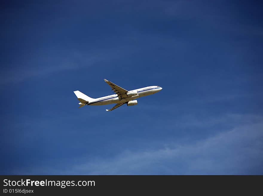 Airplane flying in the blue sky. Airplane flying in the blue sky