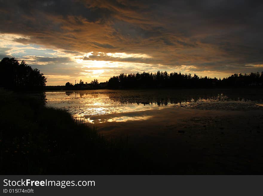 Lake at sunset with reflection in Finland