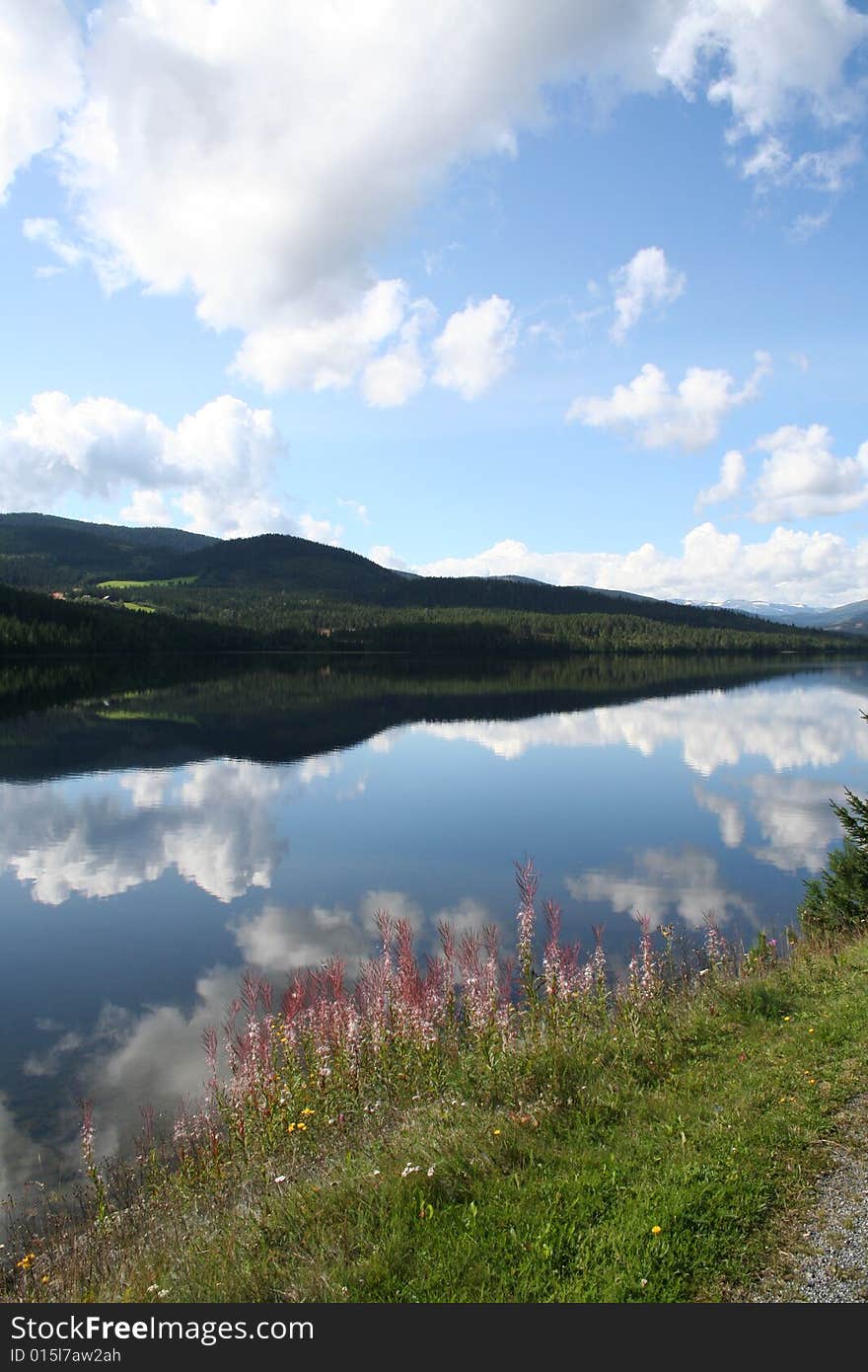 A mountain image from Norway. The reflection in a lake. A mountain image from Norway. The reflection in a lake