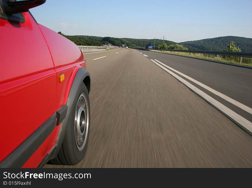 High-speed on a german Autobahn (highway in front blurred). High-speed on a german Autobahn (highway in front blurred)