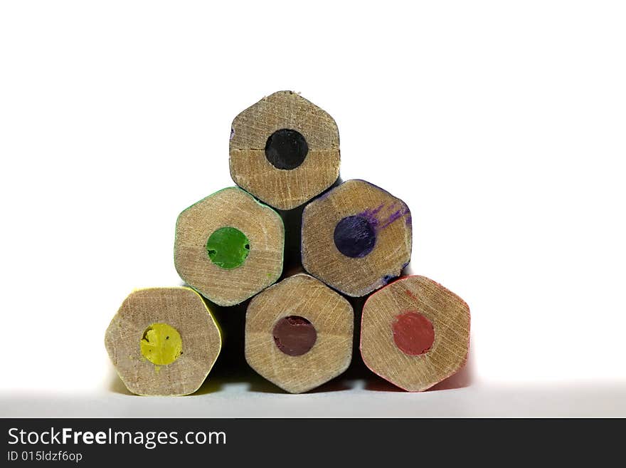 Stack of colored hexagon shaped pencils macro with copy-space concept. Stack of colored hexagon shaped pencils macro with copy-space concept