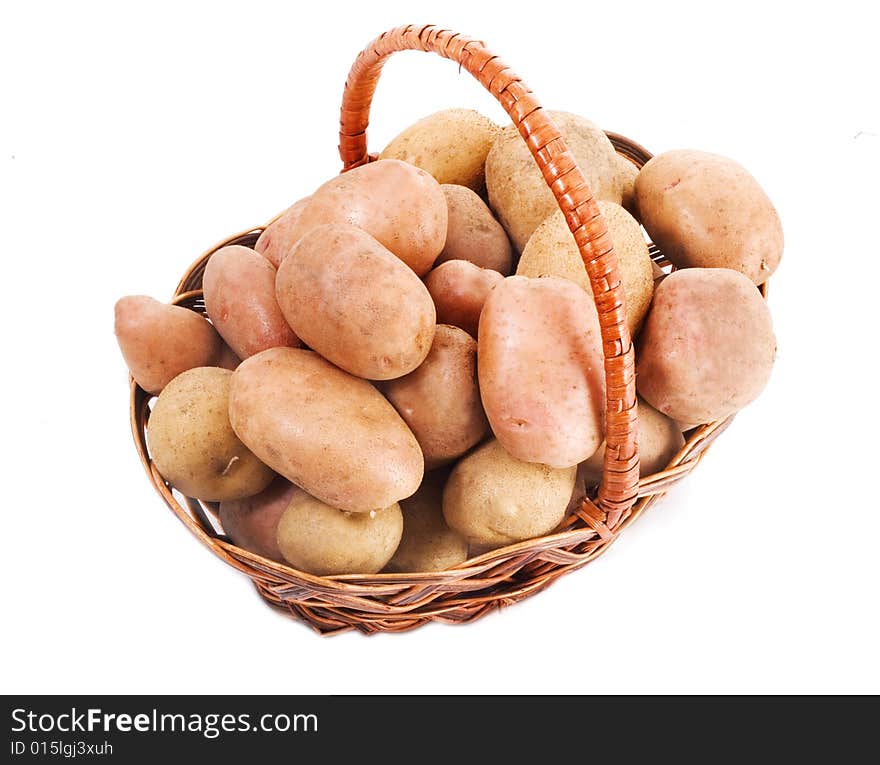 Potatoes in a basket isolated on white