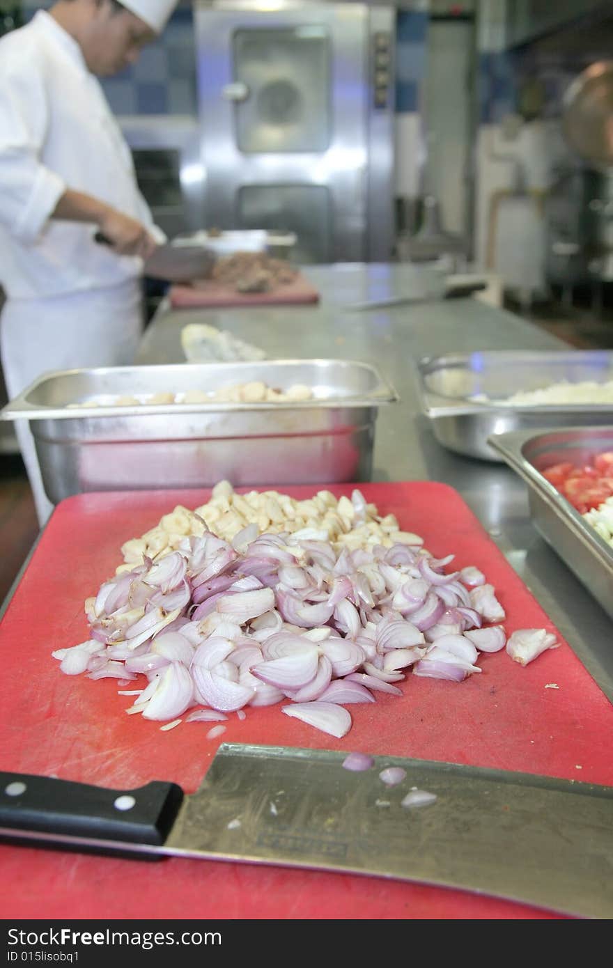 Shallot and garlic sliced in kitchen. Shallot and garlic sliced in kitchen