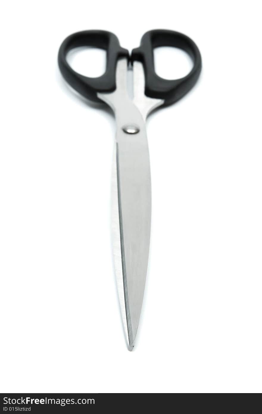 Modern metal scissors on a white background