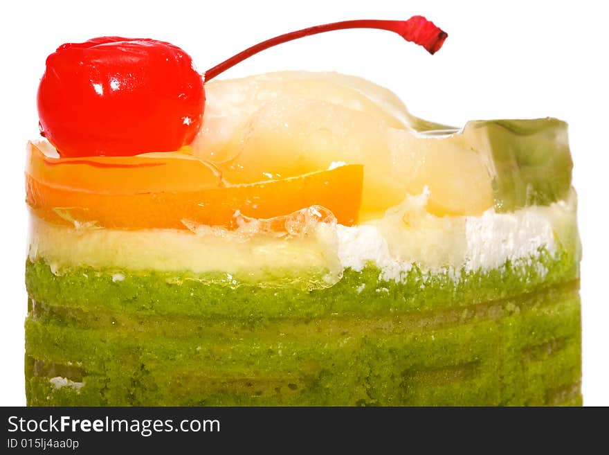 Sweet a cake with fruit on a white background