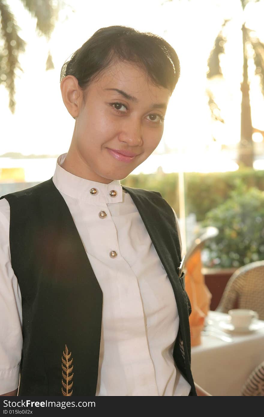 Beautiful Waiter at restaurant smiling. Beautiful Waiter at restaurant smiling