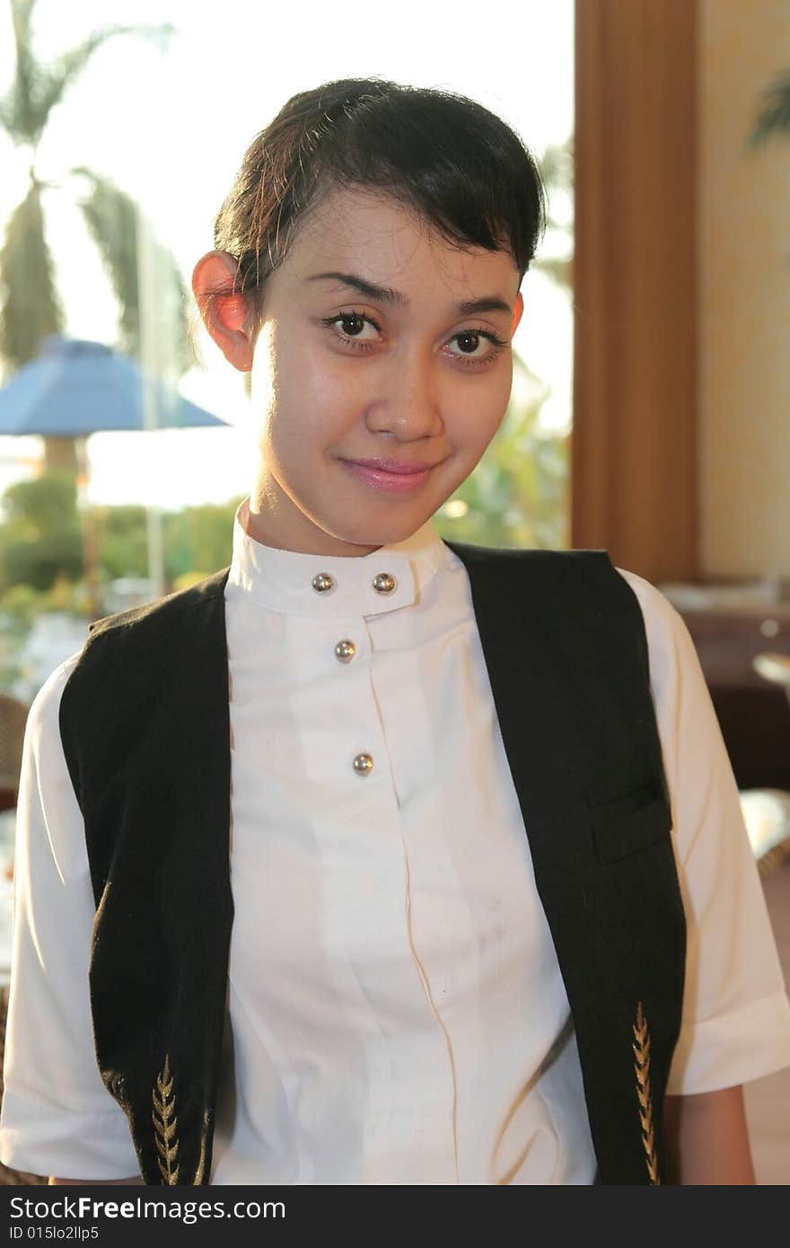 Beautiful Waiter at restaurant smiling. Beautiful Waiter at restaurant smiling