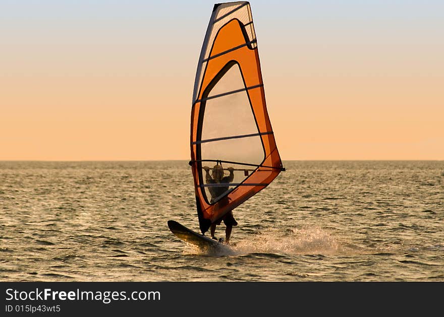 Silhouette of a windsurfer