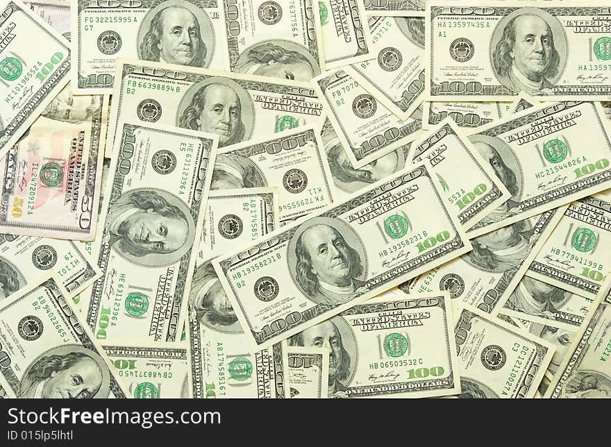 American dollars arranged at the background. American dollars arranged at the background