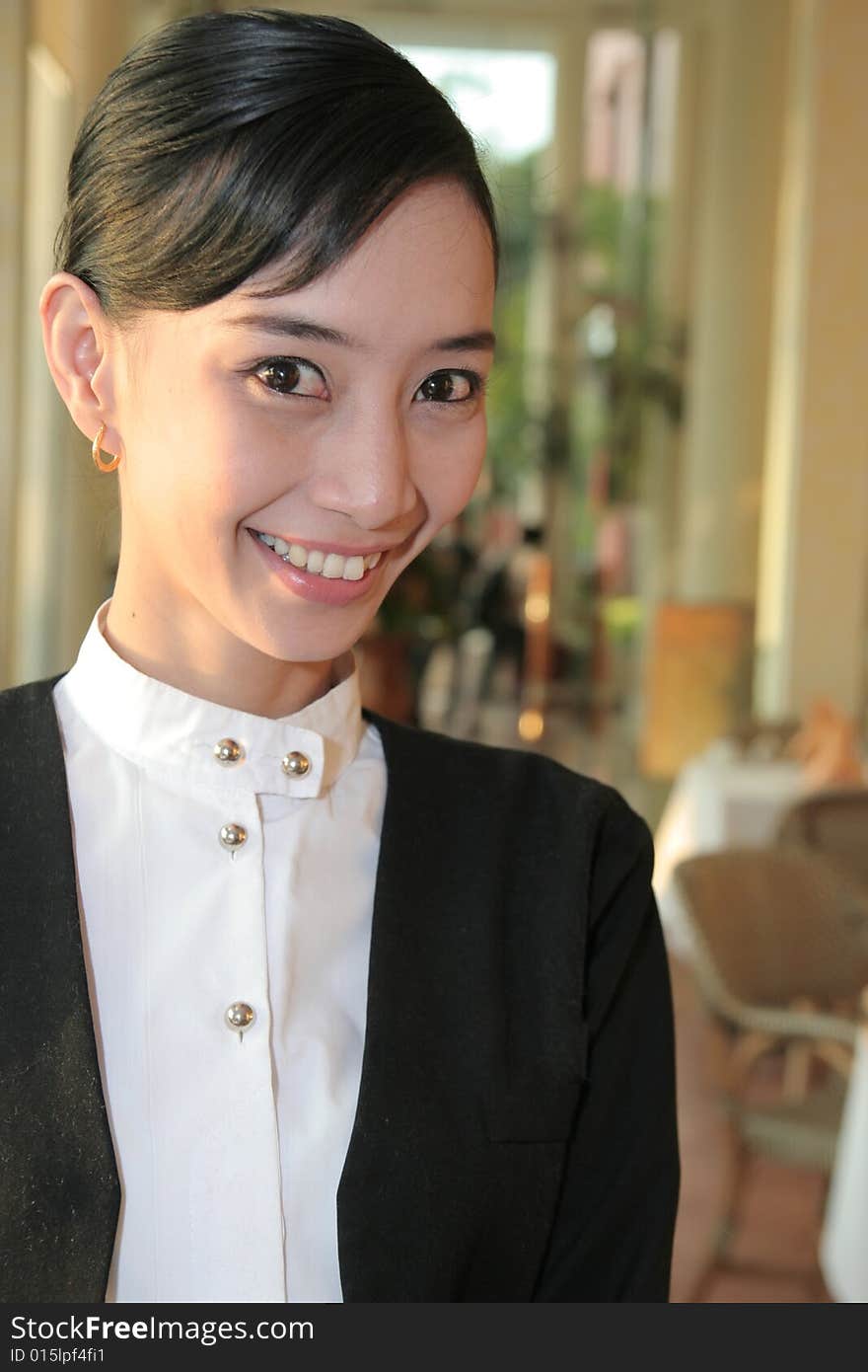 Beautiful Waiter at restaurant smiling. Beautiful Waiter at restaurant smiling