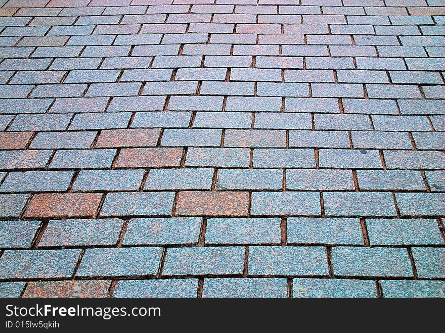 Rough texture of wet block pavement