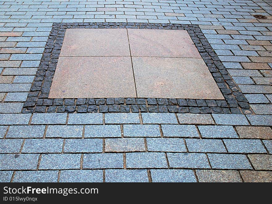 Rough texture of wet block pavement