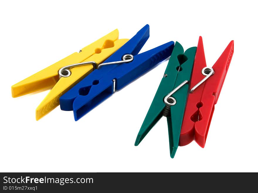 Four colored clothespins on a white background