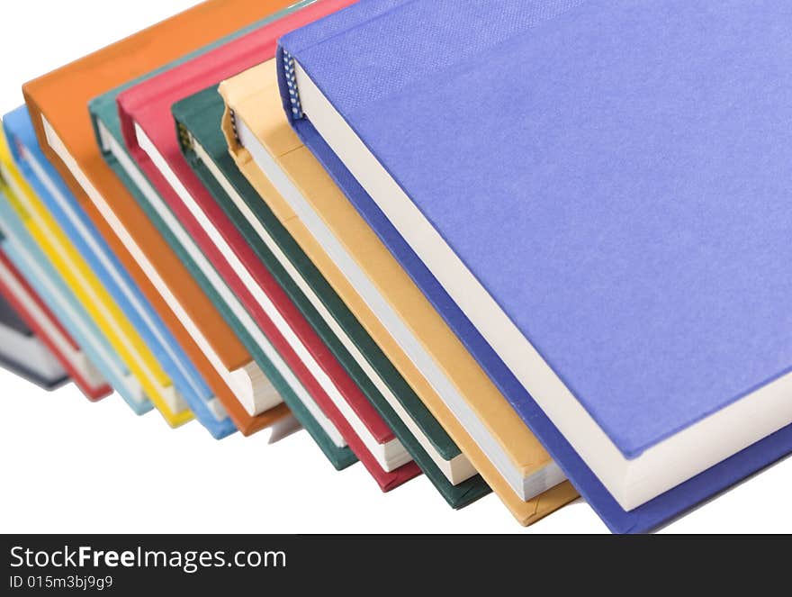 Stacked books on white background