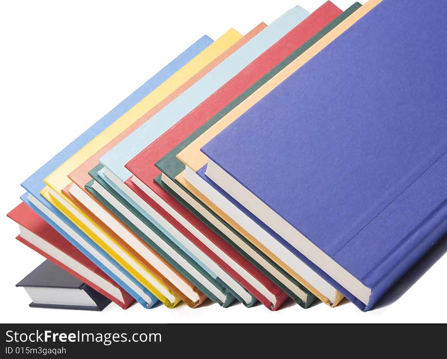 Stacked books on white background