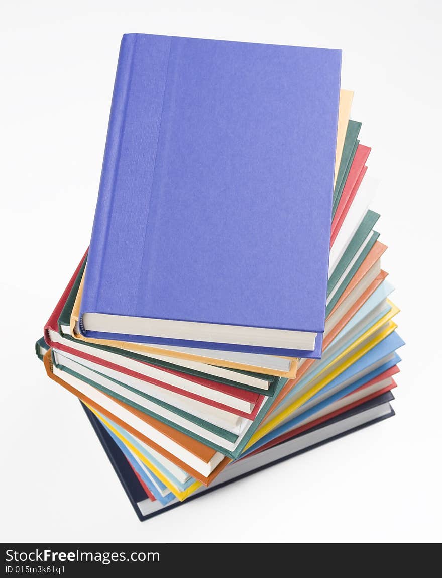 Stacked books on white background