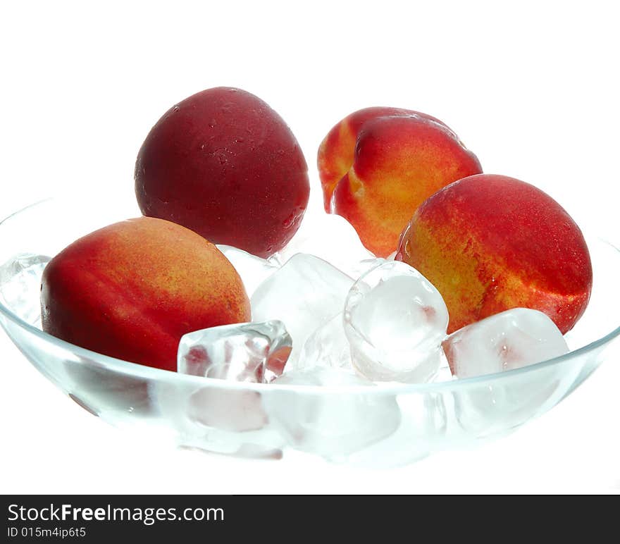 Peach in headland with ice on white background. Peach in headland with ice on white background