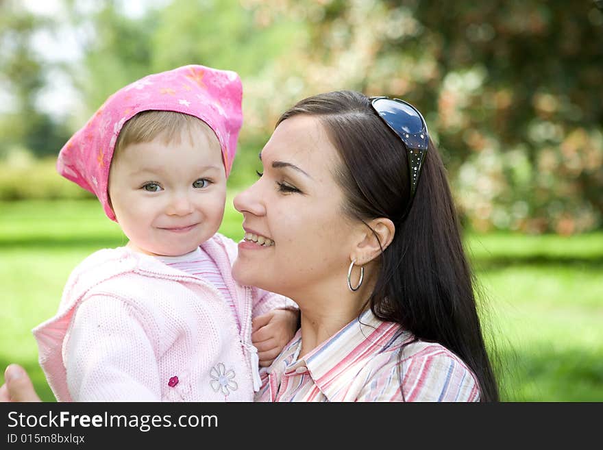 Happy family playing in park. Happy family playing in park