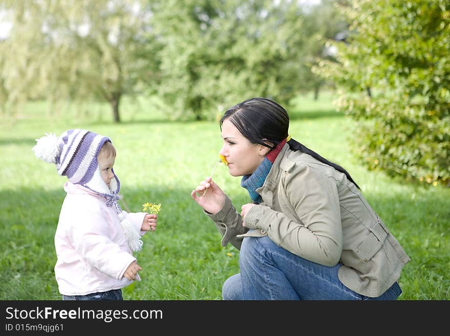 Happy family playing in park. Happy family playing in park