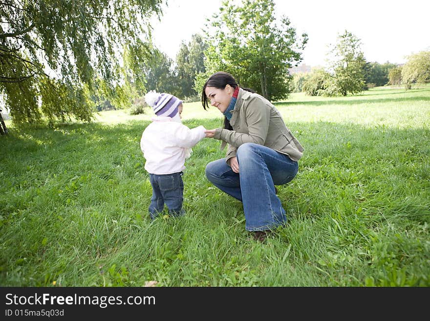 Happy family playing in park. Happy family playing in park