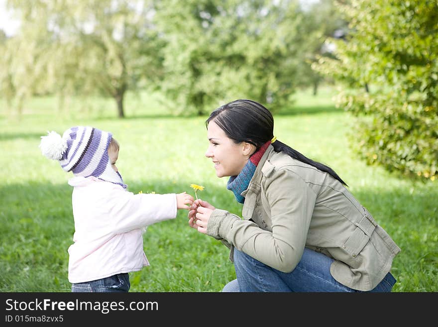 Happy family playing in park. Happy family playing in park