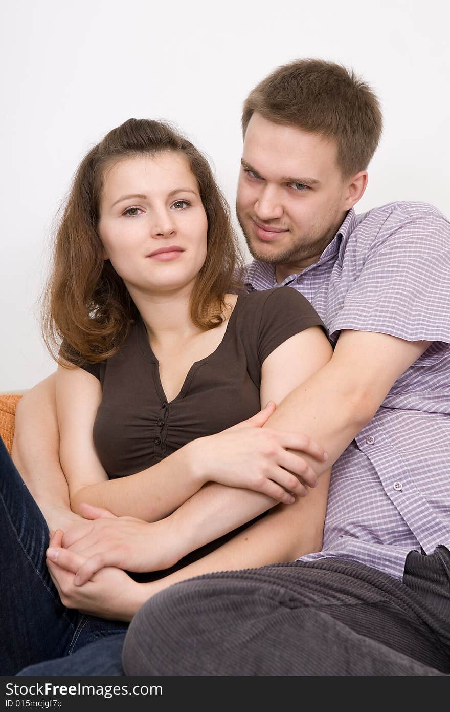 Casual couple together on sofa. Casual couple together on sofa