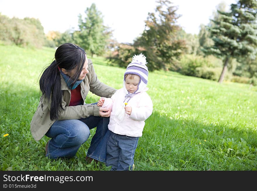 Happy family playing in park. Happy family playing in park