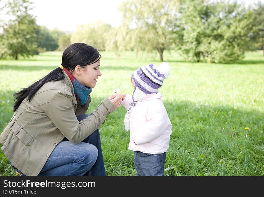 Happy family playing in park. Happy family playing in park