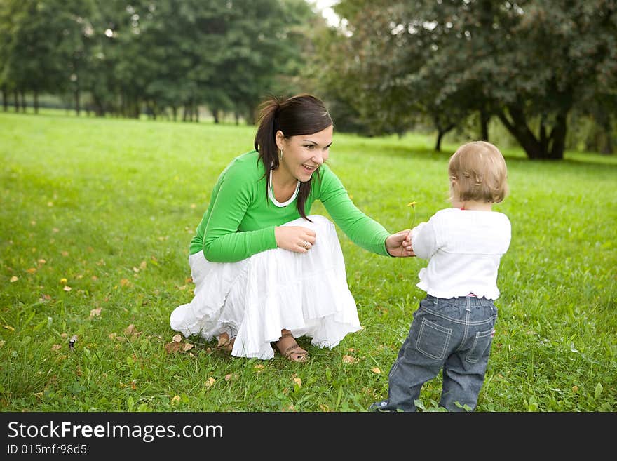 Happy family playing in park. Happy family playing in park