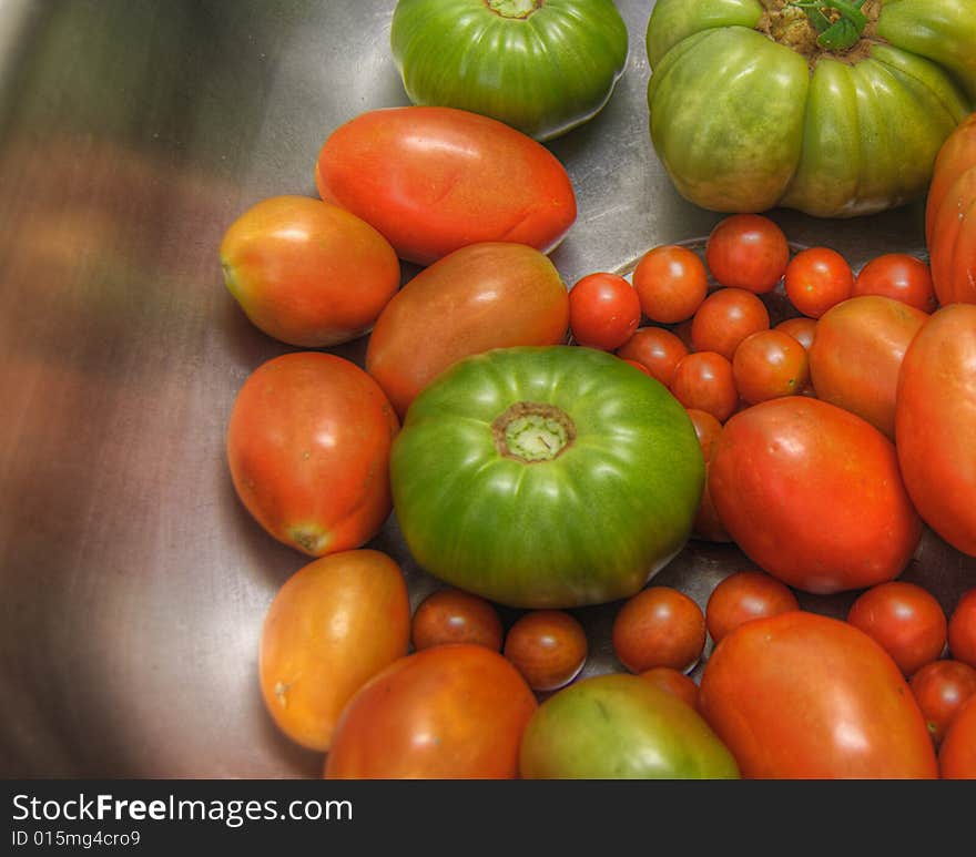 A variety of garden tomatoes ready to be used in various homemade recipes.