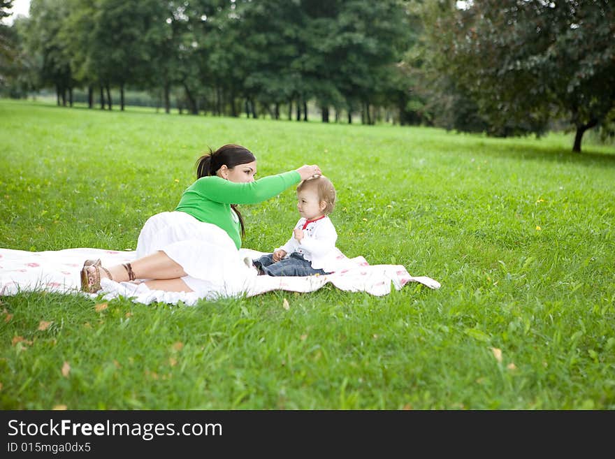 Happy family playing in park. Happy family playing in park