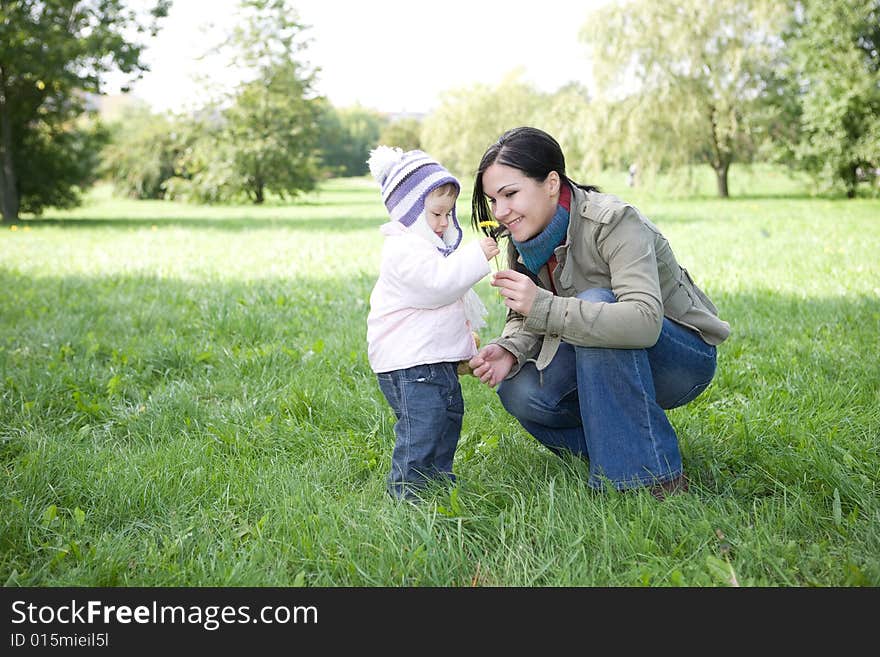 Happy family playing in park. Happy family playing in park